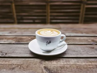 Coffee Mug sitting on a wooden table