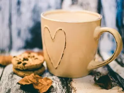 Coffee mug with cookies on the side