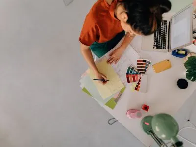 Woman with color swatches and a workstation